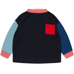 The Thin Sweater from FUB featuring an oversized fit, raglan long sleeves, a front patch pocket, and striped ribbed trim.