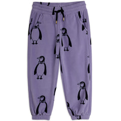 Penguin Fleece Pants by Mini Rodini with Penguin print, drawstring waist, side pockets and cuffs.