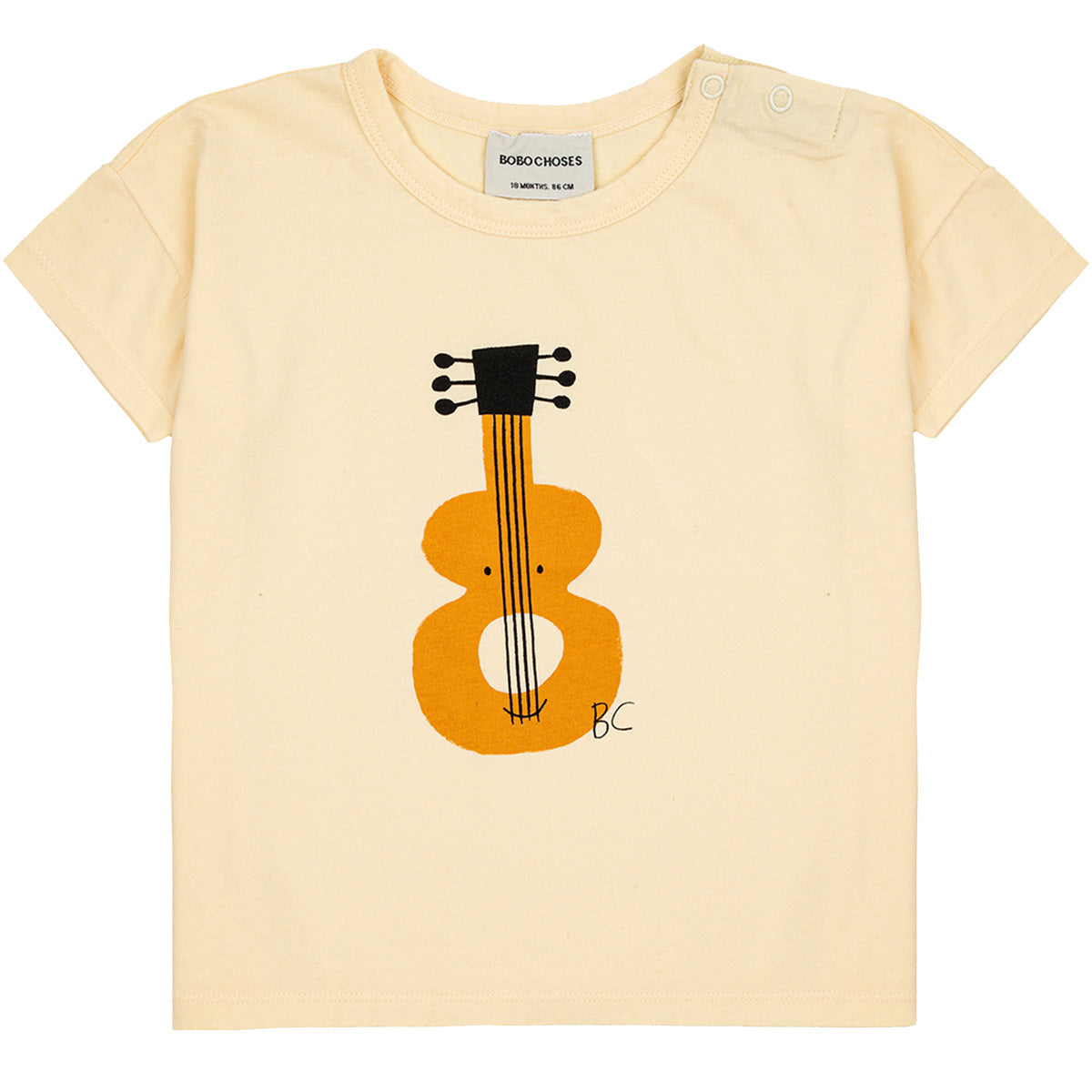 The Baby Acoustic Guitar Tee from Bobo Choses. Designed with short sleeves, dropped shoulder, shoulder snap.