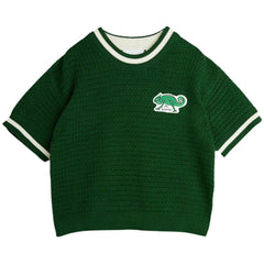 The Lizard Knitted Tee from Mini Rodini. Designed with a round collar and lizard patch in front.