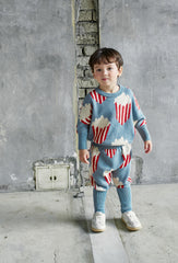 The Popcorn Pants from Momohanipopo. The pants are knitted and feature a playful popcorn bucket pattern.