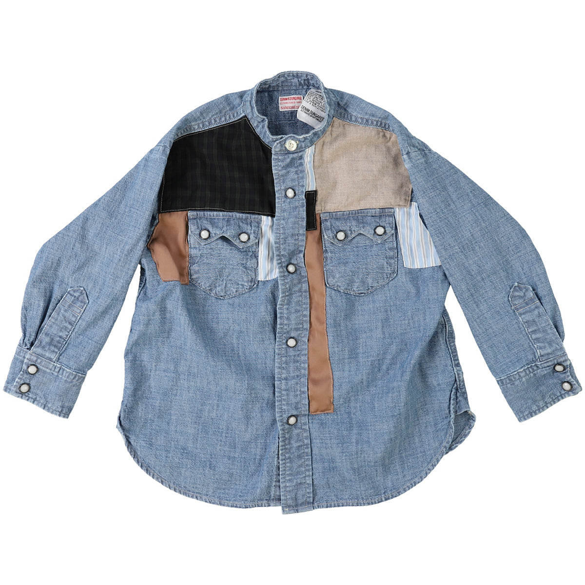The Uneven Dungaree Western Collarless Shirt from Denim Dungaree. Light blue denim shirt with a patchwork design.
