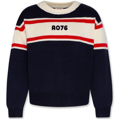 The Elly C-Neck Ao Ol by AO76 navy knit sweater with ivory and red stripes and embroidered AO76 logo.