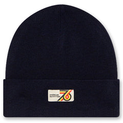 The Flups Beanie by AO76 deep navy knit beanie with a folded cuff and retro woven logo patch.