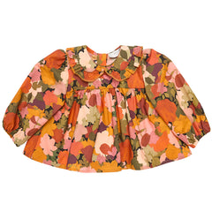 The Cotton Baby Blouse Sienna from Paade Mode. Floral print dress with puff sleeves, and a ruffled Peter Pan collar.