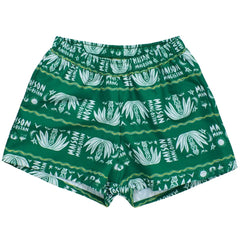 Maison Mangostan Palma Swimshorts in green with white tropical print and elastic waistband