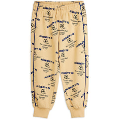 Mini Rodini Alien City FC beige sweatpants with blue soccer print and elastic waistband