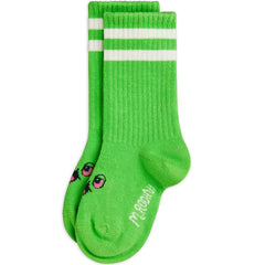 Mini Rodini green baby socks with white stripes and alien face motif