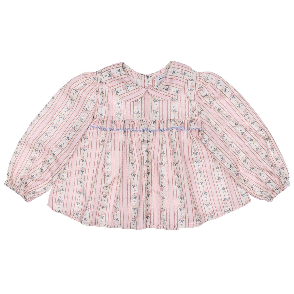 Paade Mode Coco Baby Blouse Cotton in pink floral stripes with light blue smocking, a ruffled collar, and neck bow tie.