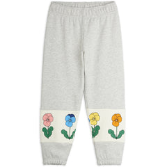 Violas Panel Sweatpants by Mini Rodini with flowers print, elastic waist and ribbed leg finishes.