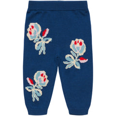 The Baby Jaquard Pants from FUB featuring a botanical jacquard pattern, low crotch fit, elastic waist, and ribbed cuffs.
