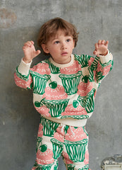The Cupcake Sweater from Momohanipopo. Cream sweater with a cupcakes topped with cherries print.