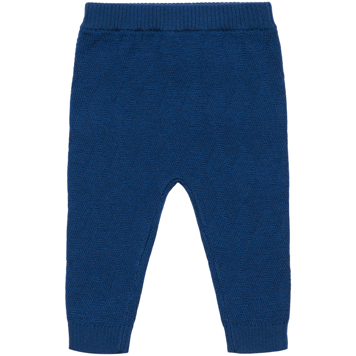 The Baby Harlekin Pants from FUB featuring a harlequin knit pattern, relaxed low crotch, elastic waist, and ribbed leg cuffs.