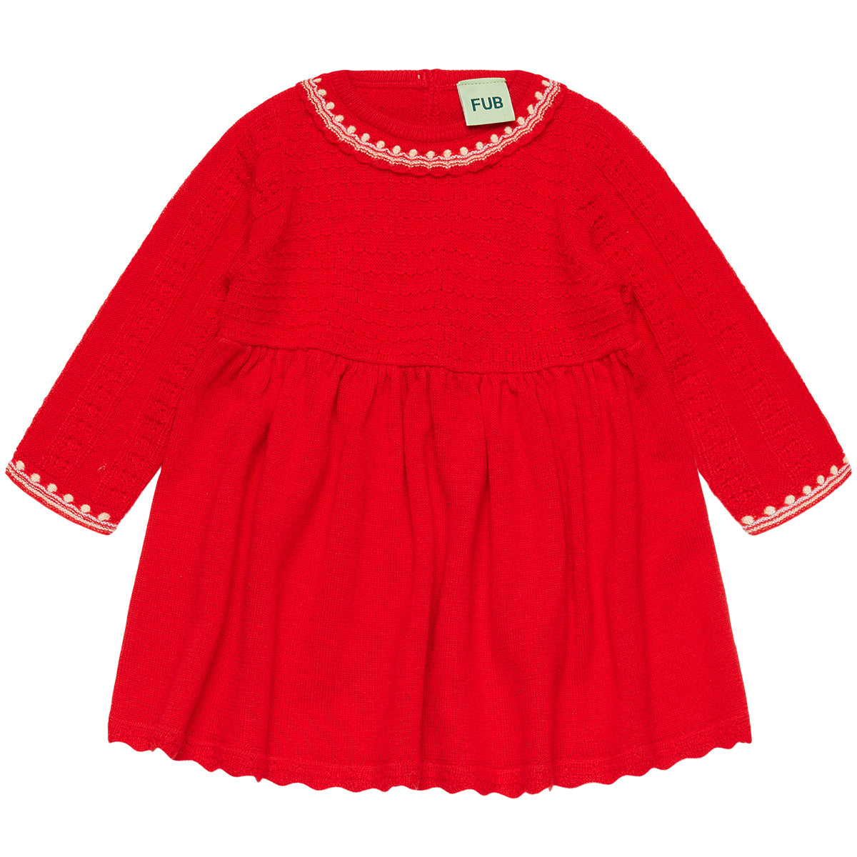 The Baby Dress from FUB featuring a contrast neck accent, textured sleeves, back shell button closure, and gathered skirt.