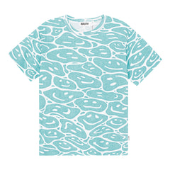The Riley Tee from Molo. Organic cotton t-shirt with in turquoise and white in an all over print of smiling faces