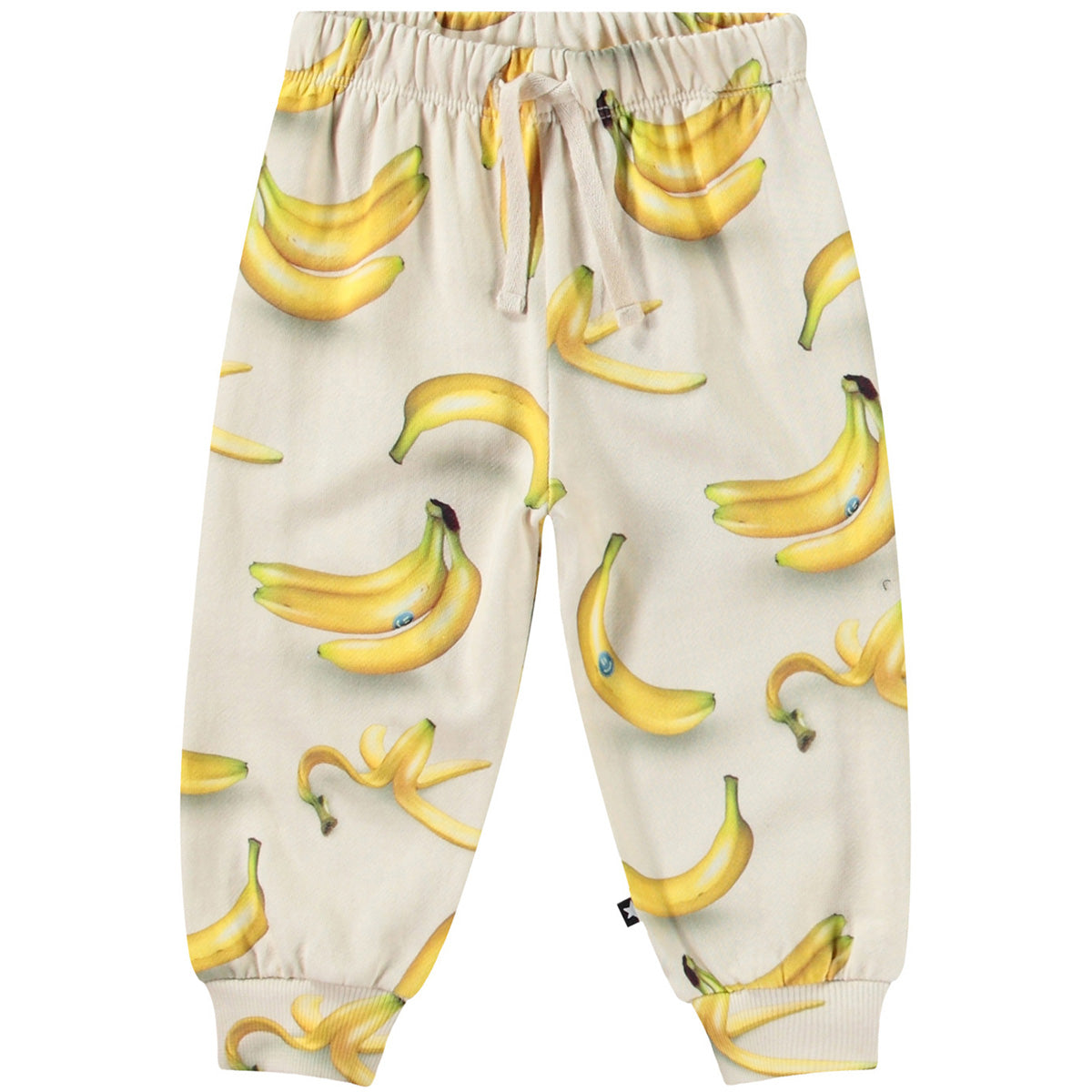 The Simeon Pants from Molo. Featuring a cream-colored background with realistic banana graphics.