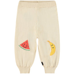 The Sol Pants from Molo. Featuring playful embroidered fruit faces—a smiling watermelon and banana.