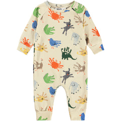 The Fairfax Romper from Molo. This beige baby romper features a playful multicolor handprint animal print.