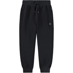 The Alvar Sweatpants from Molo black kids sweatpants with drawstring waist and cuffed ankles.