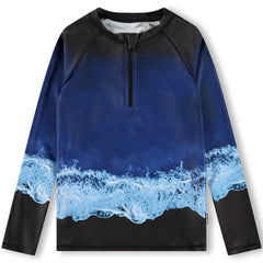 The Noble Swim Shirt from Molo in blue shades with sea print, a stand-up collar, a front zip, and long raglan sleeves.