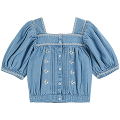 The Chambray Embroidered Blouse from Emile et Ida. Powder-beige cotton blouse dotted with bunches of flowers.