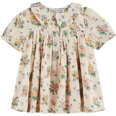 Spring Loose Fitting Dress by Emile et Ida. A vintage-inspired dress with a delicate floral print, ruffled collar, and puff sleeves.