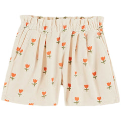 The Cream Tulip Terry Shorts from Emile et Ida. Off-white terrycloth shorts, printed with vermilion-red all-over tulips.