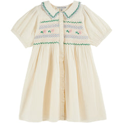Hand Smocked Embroidered Dress by Emile et Ida. Featuring delicate smocking, floral embroidery, scalloped collar.