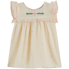 Heart Embroidered Baby Dress from Emile et Ida. A soft ecru dress with delicate hand-stitched embroidery, flutter sleeves.
