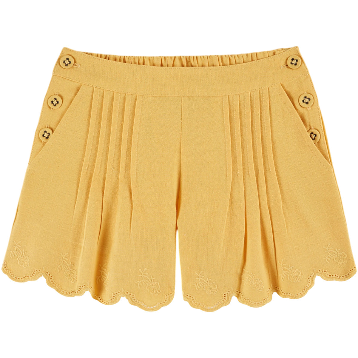 The Embroidered Shorts by Emile et Ida, yellow pleated shorts with scalloped hem and delicate floral embroidery.