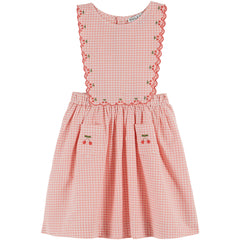 The Cherry Embroidered Apron Dress by Emile et Ida, pink gingham dress with scalloped bib and cherry embroidery details.