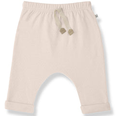 The Alain Pants from 1+ in the Family, soft baby pants with an elastic waistband, drawstring, and rolled cuffs.
