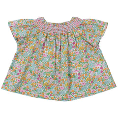 The Andreas Baby Blouse from The New Society. Short-sleeved raglan, smoke with hibiscus-colored thread.