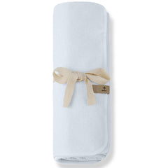 The Asis Blanket from 1+ in the Family, a soft baby blanket in lightweight textured fabric tied with a ribbon.