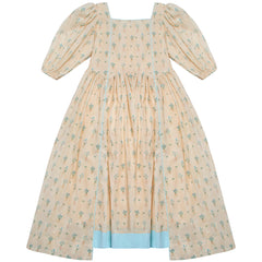 Astral Dress by The Middle Daughter. Cotton voile midi dress in hand-painted print, with asymmetric hems, contrast binding edging