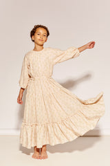 The At The End Of The Day Dress by The Middle Daughter in cream floral print with tiered maxi silhouette.