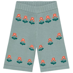The Flowers Baby Knitted Pant from Tiny Cottons. Green knitted pants with red floral patterns on a white background.