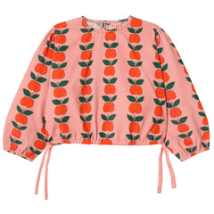 The Apples Blouse from Tiny Cottons. Pink blouse with apple pattern on a white background