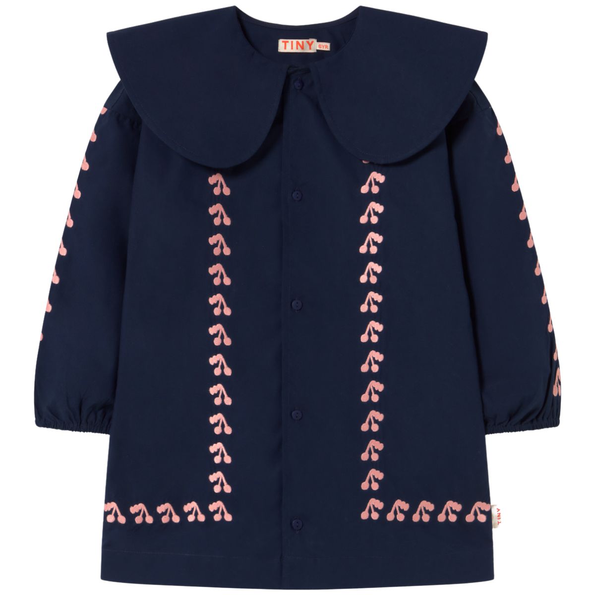 The Mini Cherries Dress from Tiny Cottons. Navy blue dress with pink embroidery on a white background.