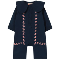 The Mini Cherries One piece from Tiny Cottons. Navy blue baby romper with pink embroidery on a white background.