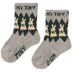 The Rabbits Wool Medium Socks from Tiny Cottons. Pair of gray socks with bunny pattern and 'Tiny' text.