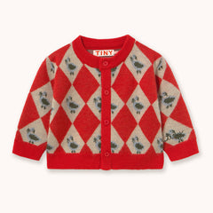 A red and beige argyle knit cardigan sweater by designer Tiny Cottons with small green bird motifs, featuring a button-up front and ribbed collar, cuffs, and hem. The brand name 'TINY BEAR' is visible on the inner neck label.
