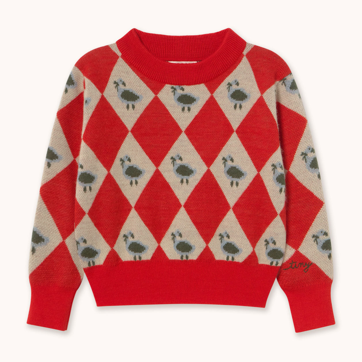 A red and beige argyle sweater by designer Tiny Cottons featuring a pattern of small birds in each altrenating red diamond, with solid red ribbed trim at the collar, cuffs, and hem.