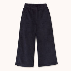 A pair of dark navy corduroy cropped pants with an elastic waistband by designer Tiny Cottons, shown flat against a light cream background.