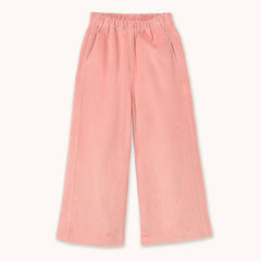 A pair of children's wide-leg corduroy pants in a soft pink color by designer Tiny Cottons, featuring an elastic waistband and side pockets, shown flat on a light cream background.