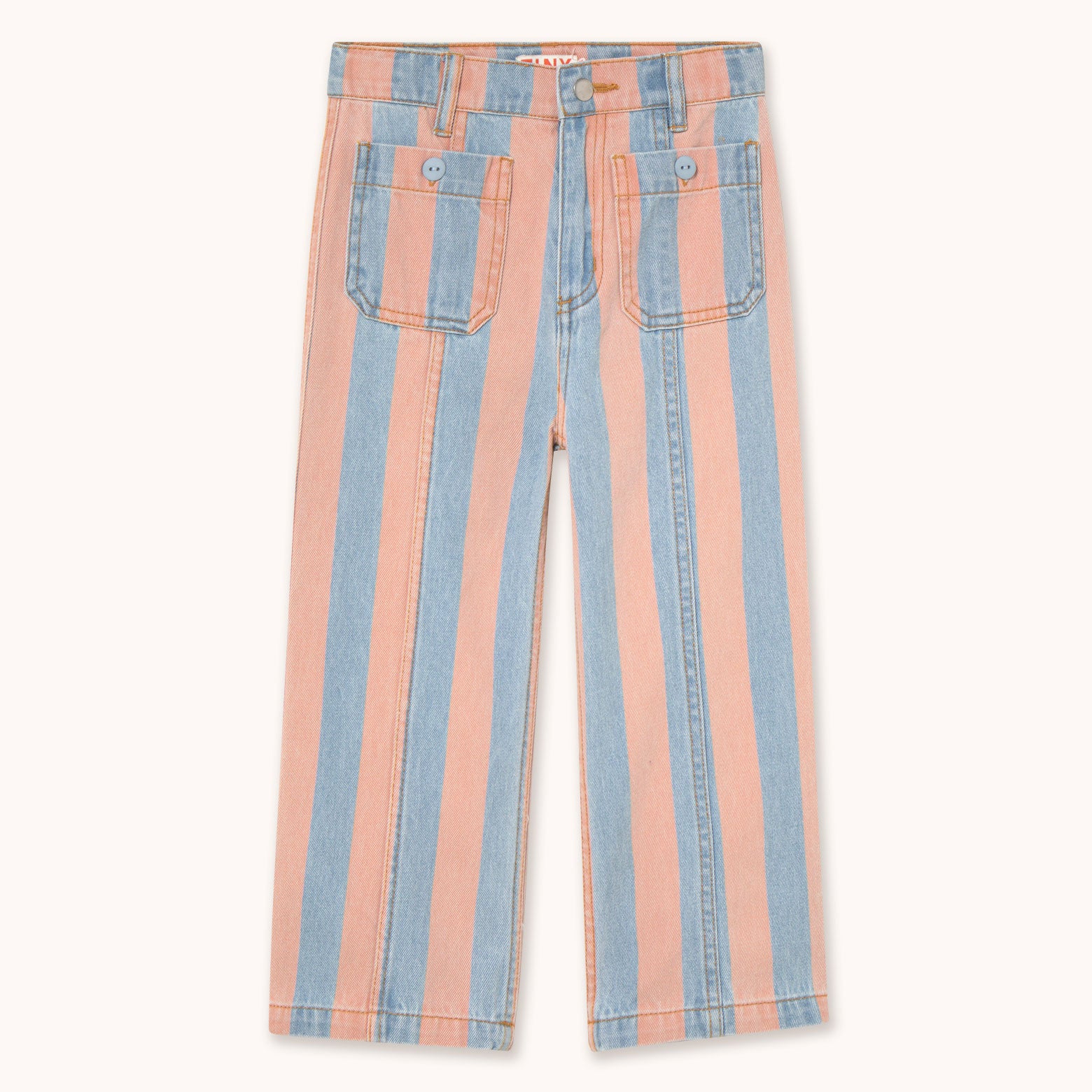 Striped denim jeans with vertical light blue and peach-pink stripes by designer Tiny Cottons, featuring classic five-pocket styling and a button fly, shown flat against a light cream background.