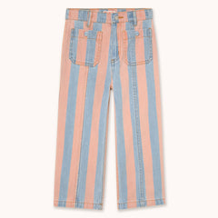 Striped denim jeans with vertical light blue and peach-pink stripes by designer Tiny Cottons, featuring classic five-pocket styling and a button fly, shown flat against a light cream background.