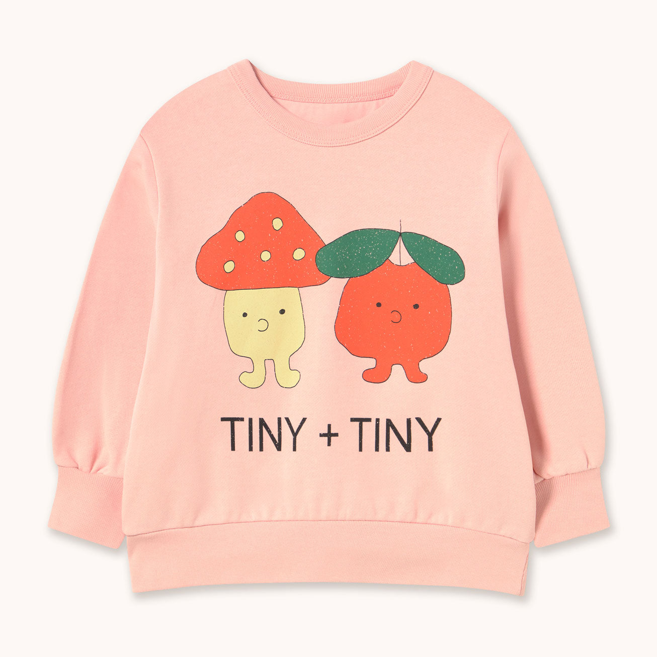 A light pink long-sleeve sweatshirt by designer Tiny Cottons featuring a cute graphic of two tiny cartoon characters and the text 'TINY + TINY' printed on the front, displayed against a clean off-white background.