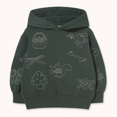 A dark gray children's pullover hoodie with white line-art illustrations of a bird, basket, bow, mushroom, squirrel, flowers, and the word 'tiny' printed on the front, by designer Tiny Cottons, shown against a light cream background.