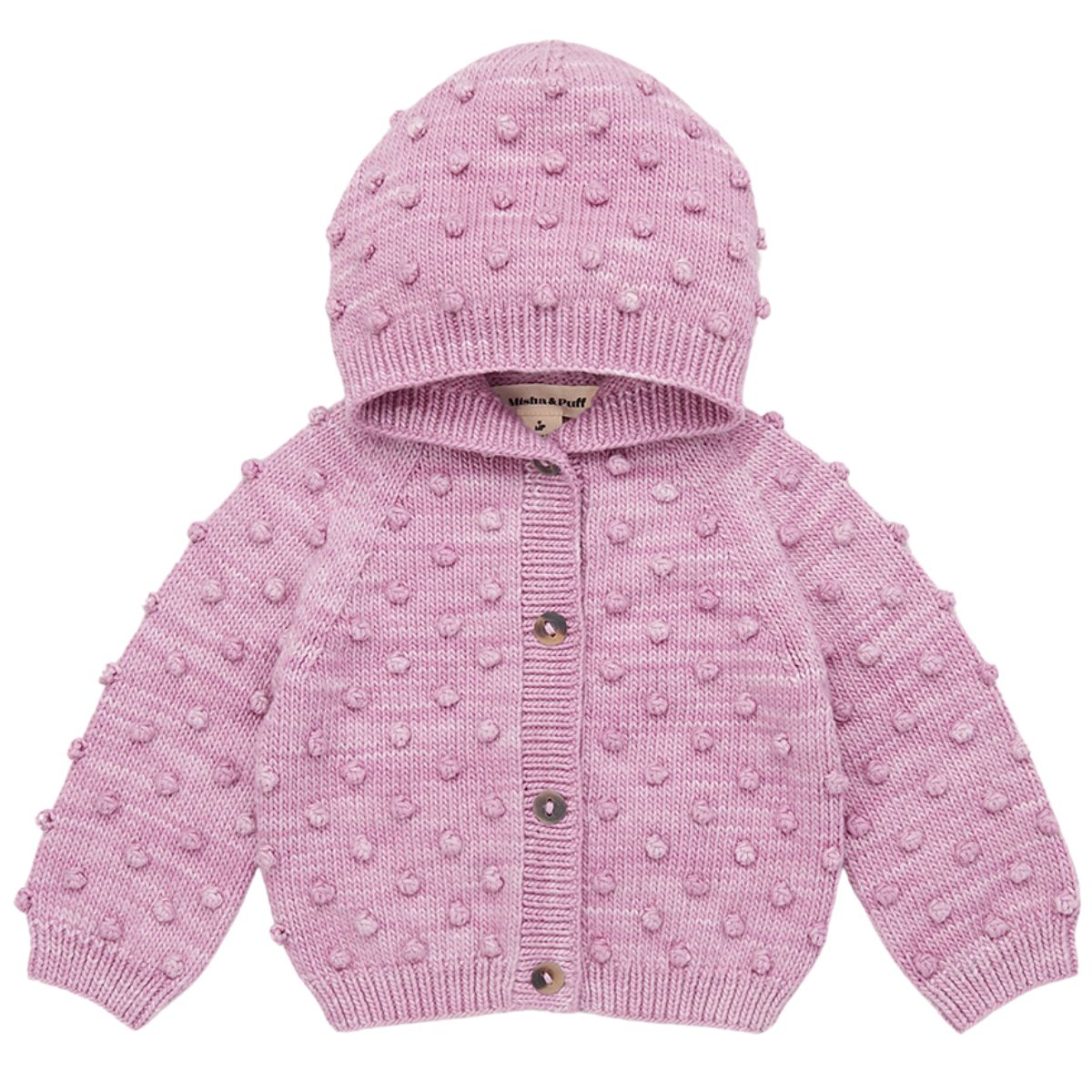 The Hooded Popcorn Cardigan by Misha & Puff. A cozy pink knit cardigan featuring a hood and textured pom-pom details